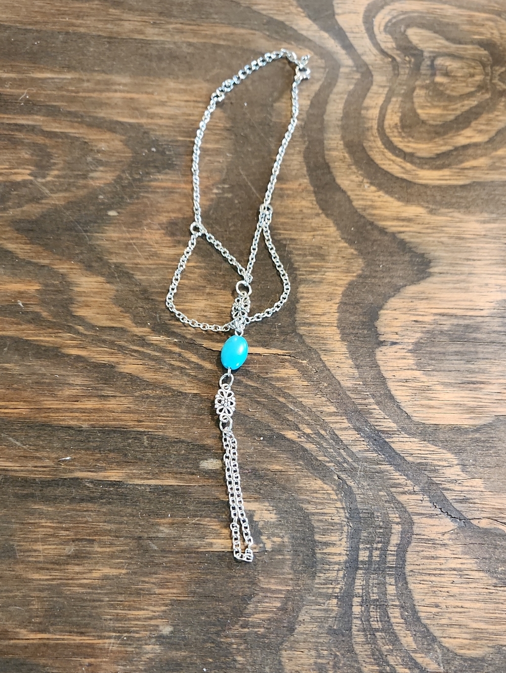 Silver-Tone Hand Bracelet with Turquoise Bead Accent